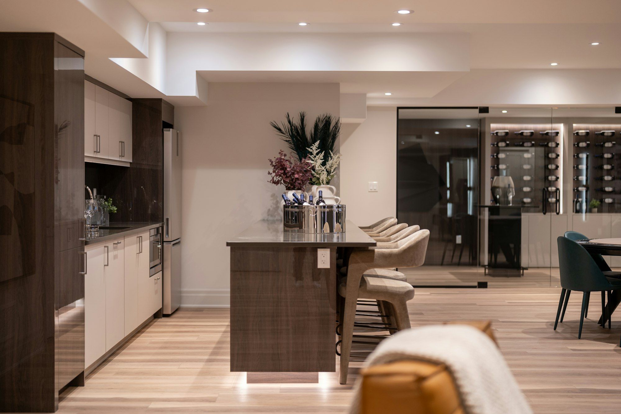 Finished basement with a walnut wet bar, quartz top and a glass wine room