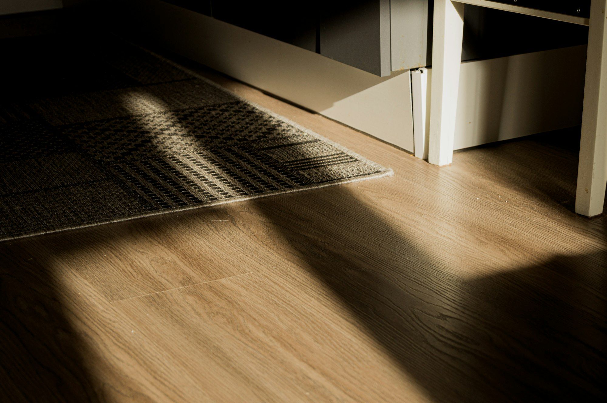 Hallway oak floor with strong afternoon light and shadows