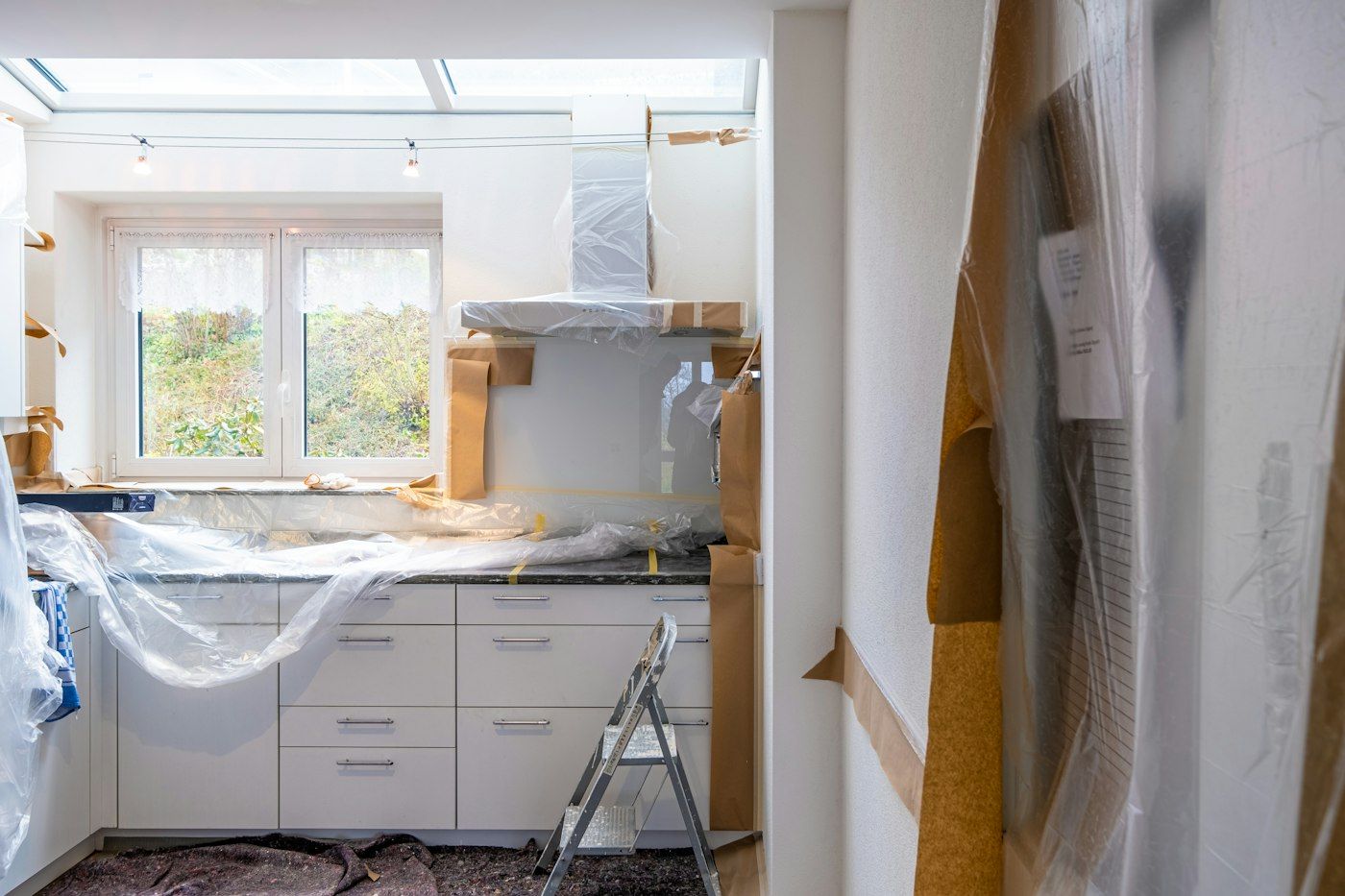 New white base cabinets wrapped in protective plastic