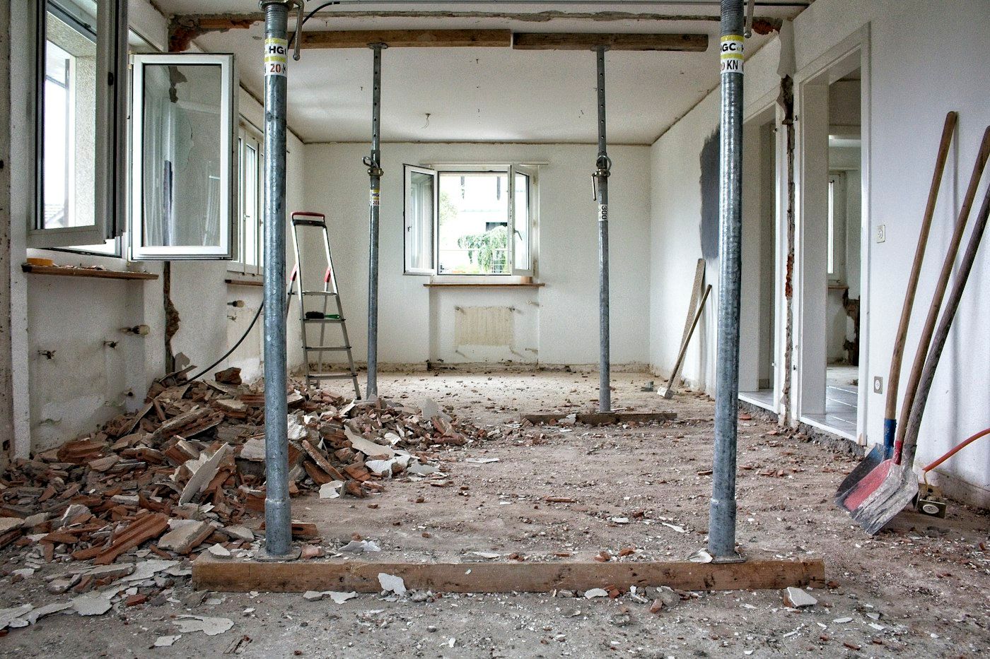 Room stripped to the studs with temporary shoring posts
