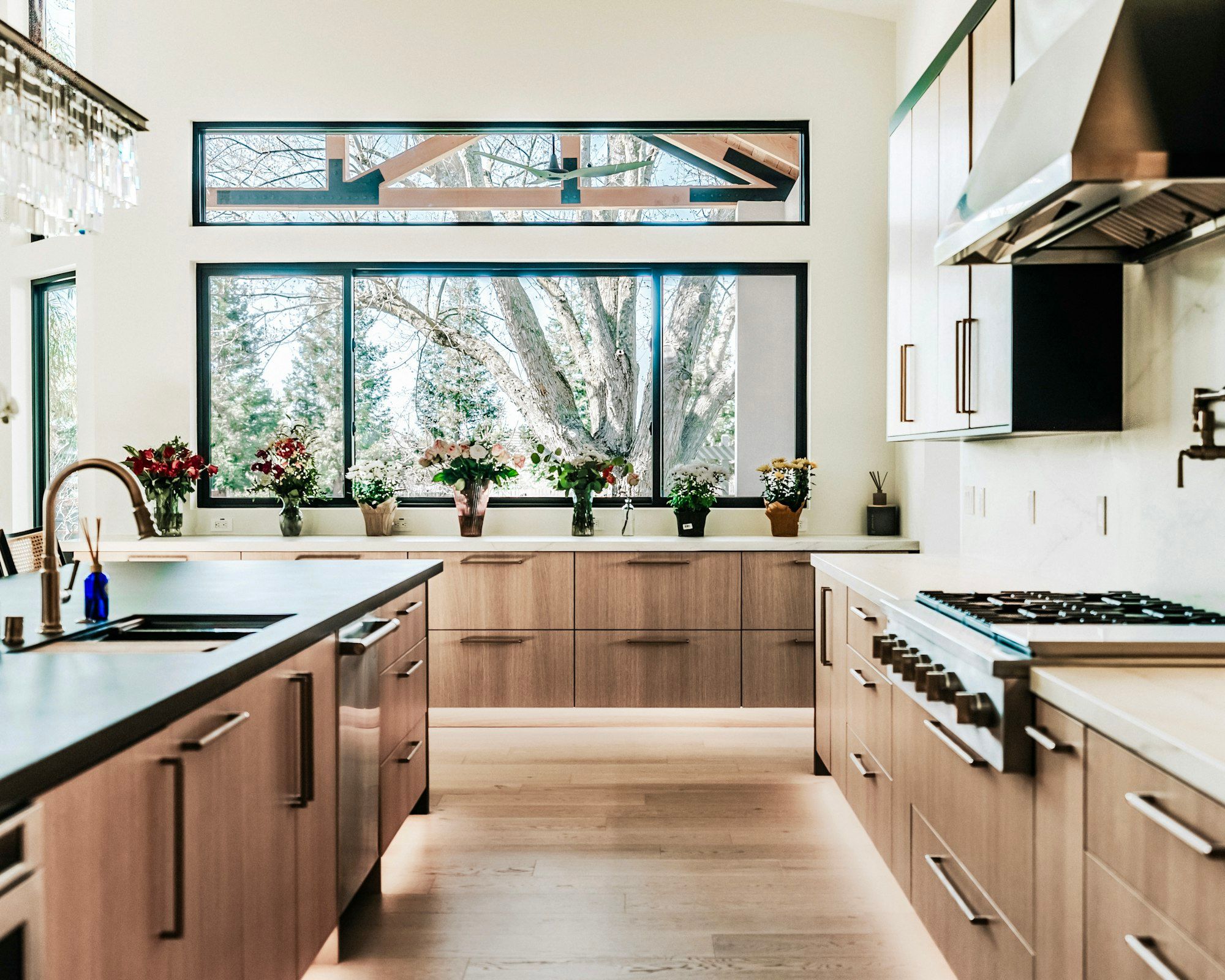 Oak kitchen with a wall of windows over the sink