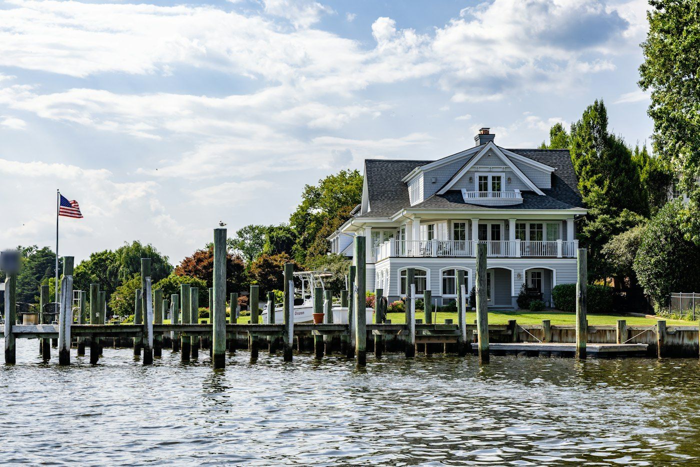 Lake house with a long wooden dock on Crane Lake