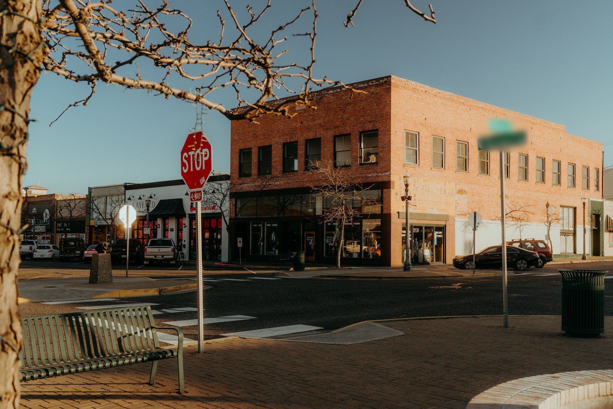 Brick storefronts on a sunny street corner in downtown Millbrook