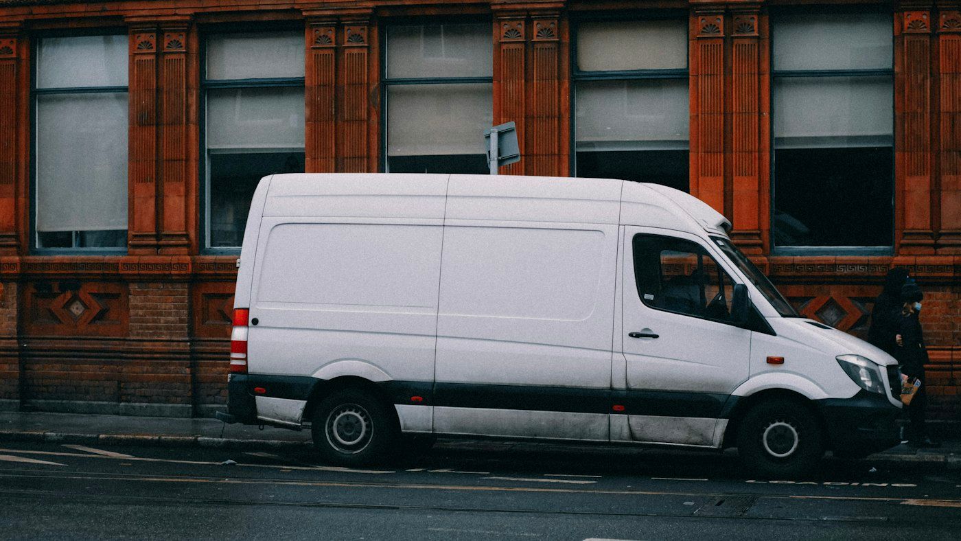 White service van parked on the street