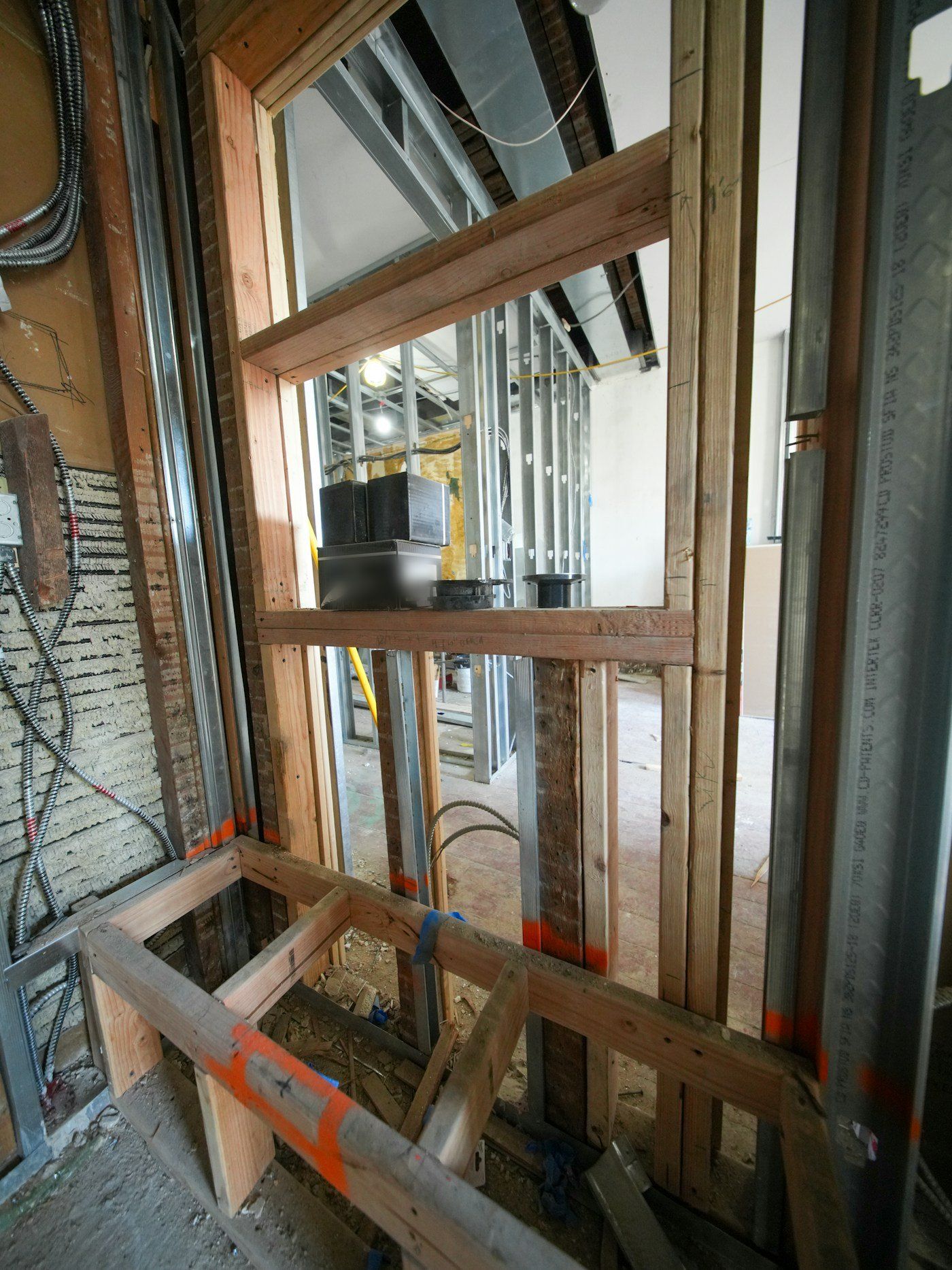 Open framing with electrical boxes and cable