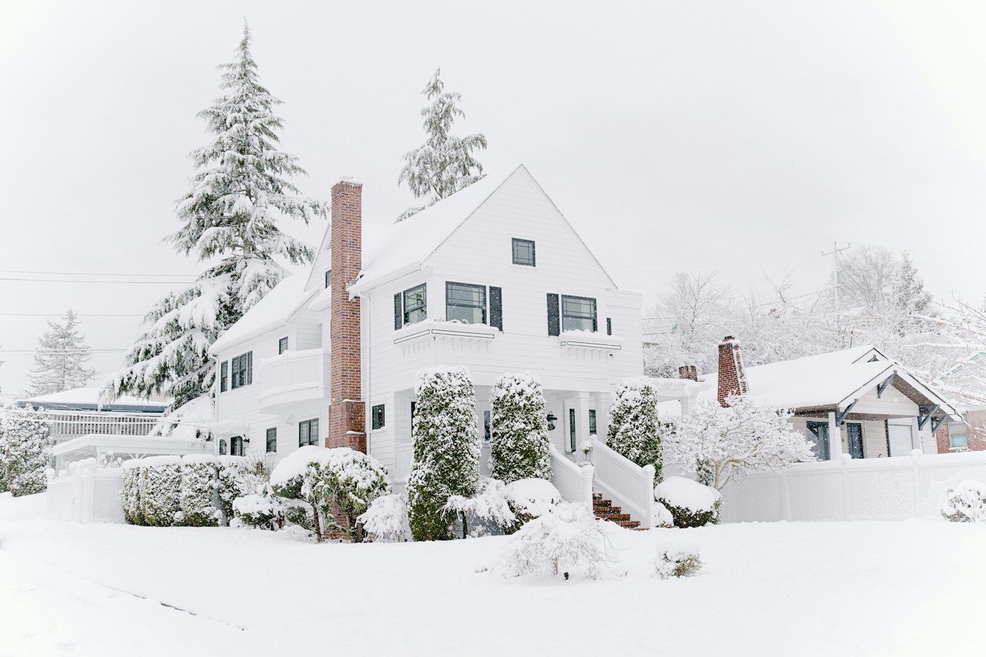 Houses covered in fresh snow on a winter morning