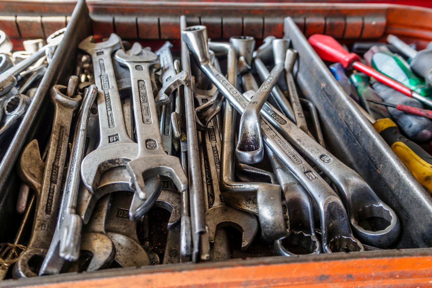 Drawer full of wrenches and hand tools in a service van